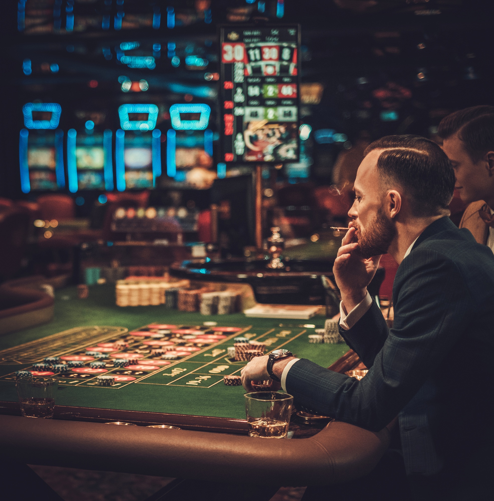 Upper class friends gambling in a casino