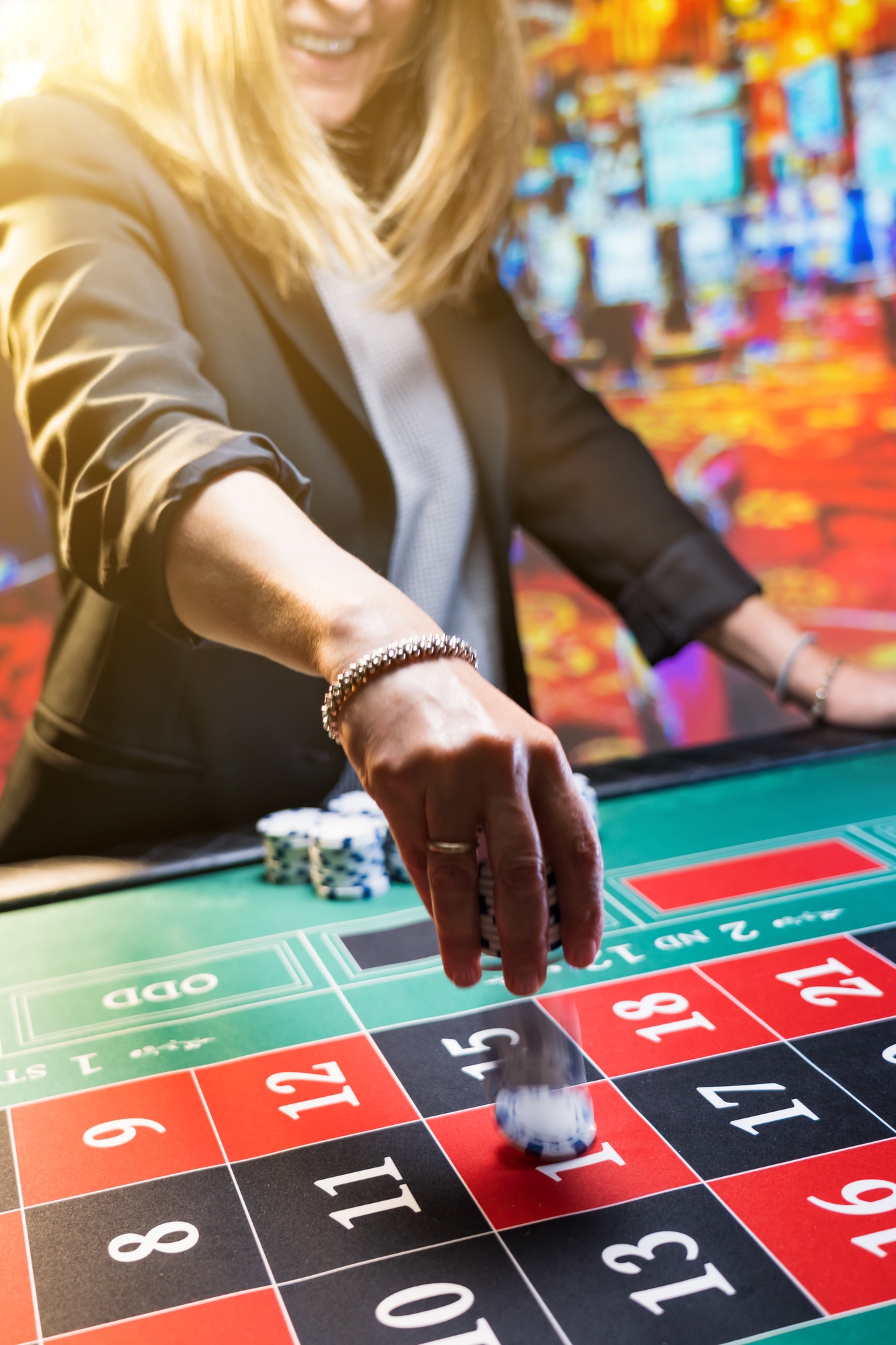 Woman playing roulette at the casino