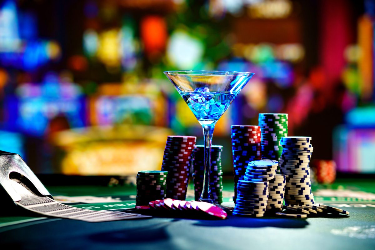 Craps dice in cocktail glass on the casino gambling table